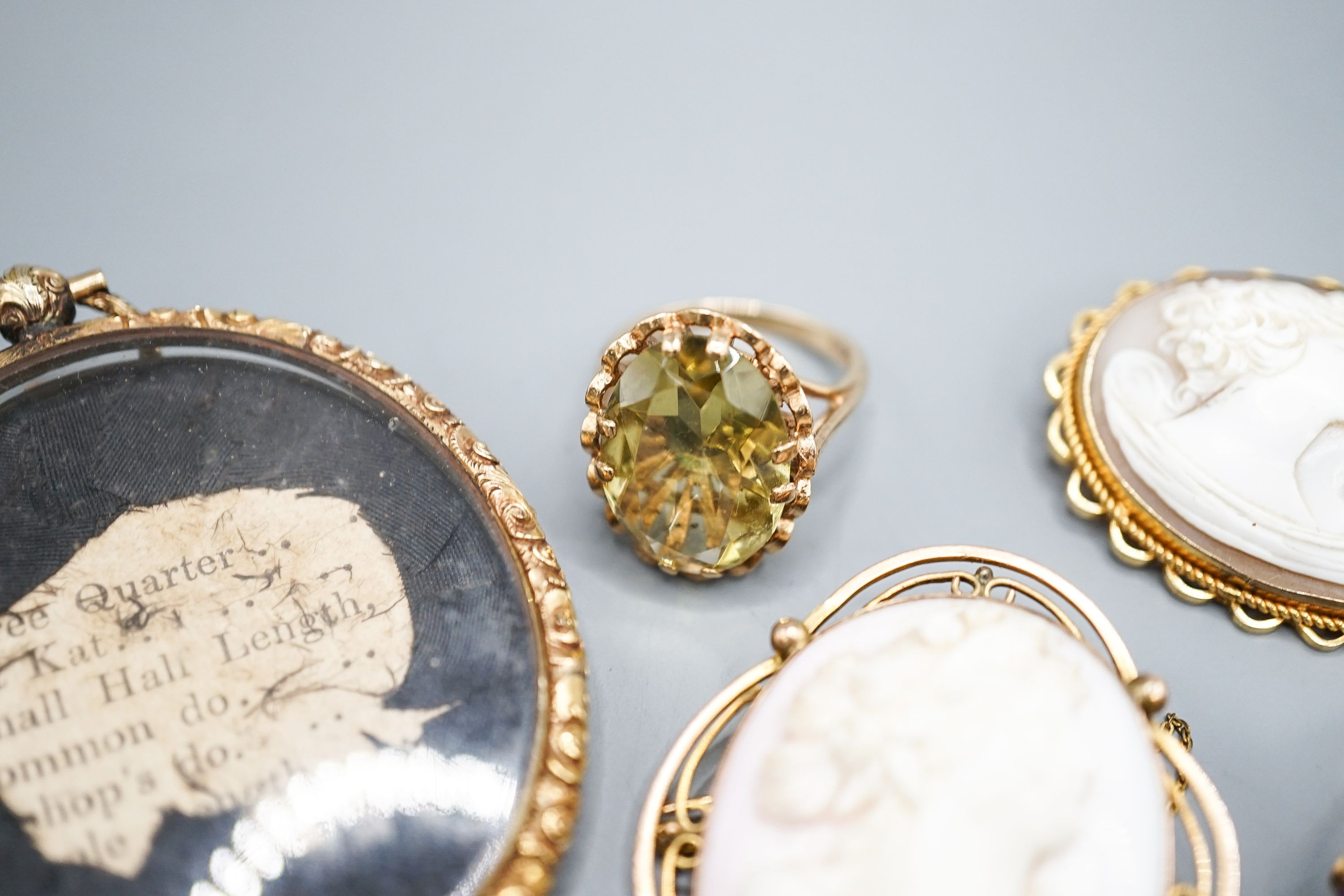 Two modern 9ct gold and gem set rings, a 9ct and gem set pendant, two 9ct mounted cameo shell brooches, gross weight 36.5 grams and a Victorian oval pendant frame, 55mm.